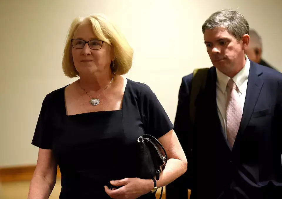 Anna Barbara Hantz Marconi leaving court with her lawyer, Oliver Bloom